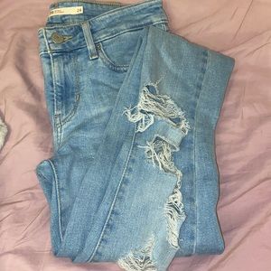 Levi’s light wash and mid rise skinny ripped jeans